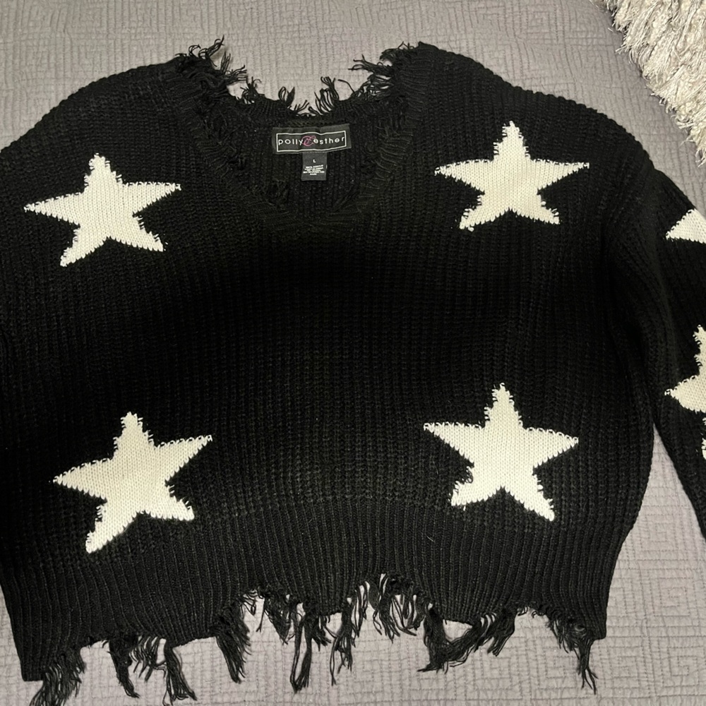 Oversized, semi crop, distressed pullover sweater.